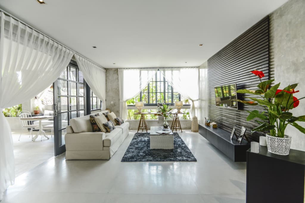 Modern villas in Bali for sale with large windows and bright, spacious interiors are in demand, like this one in Seminyak