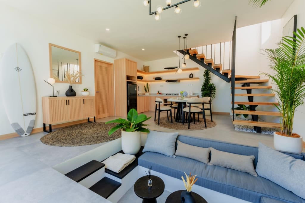 Open-plan living room with sunken seating area in a savvy modern villa investment. Bali Real Estate for sale