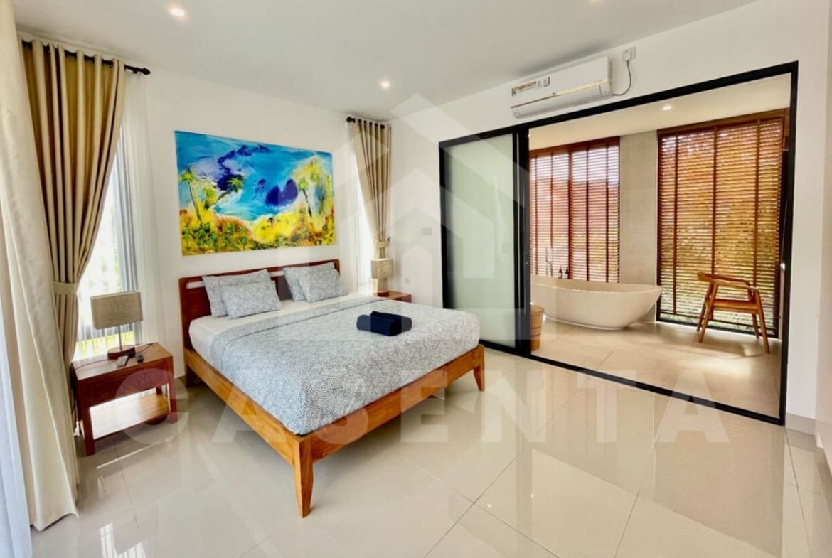 Bedroom with ensuite bathroom inside stunning villa in Seminyak