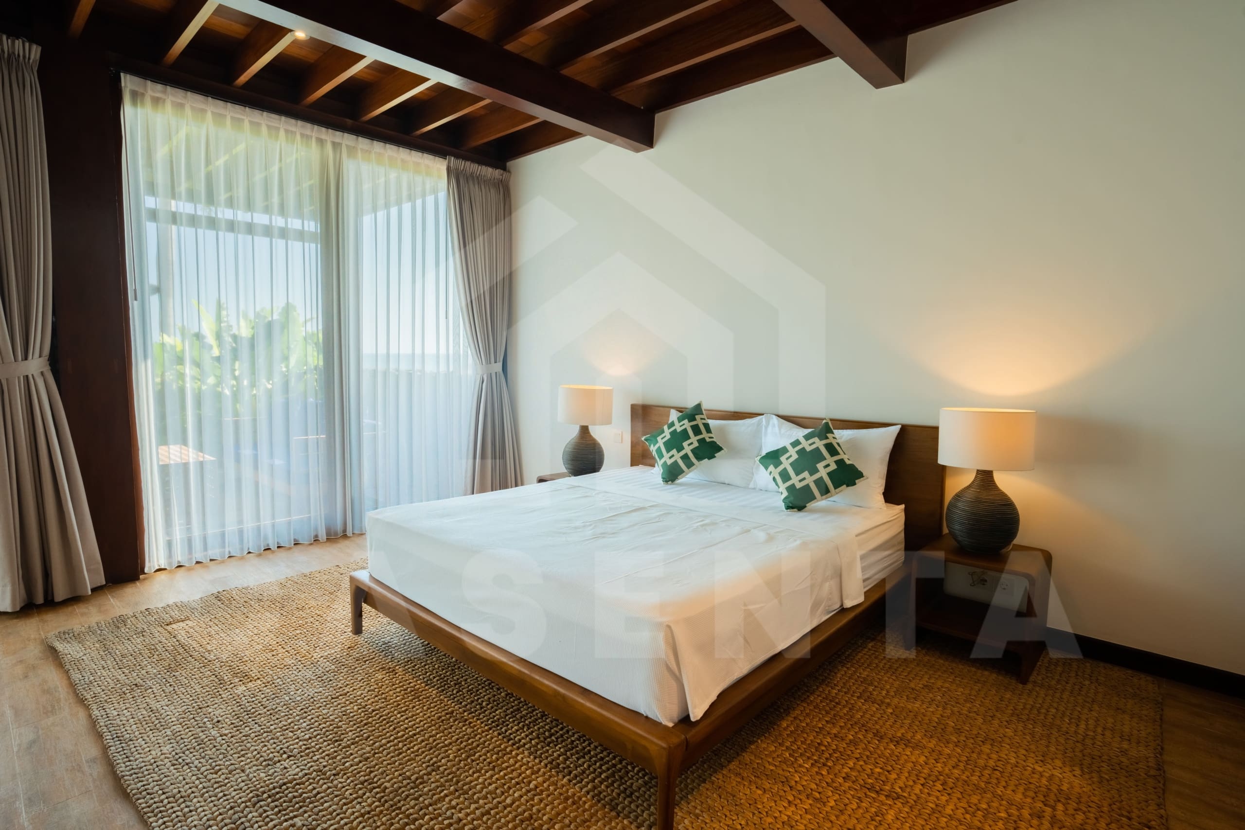 Comfortable bedroom inside tropical villas in Tabanan coastline