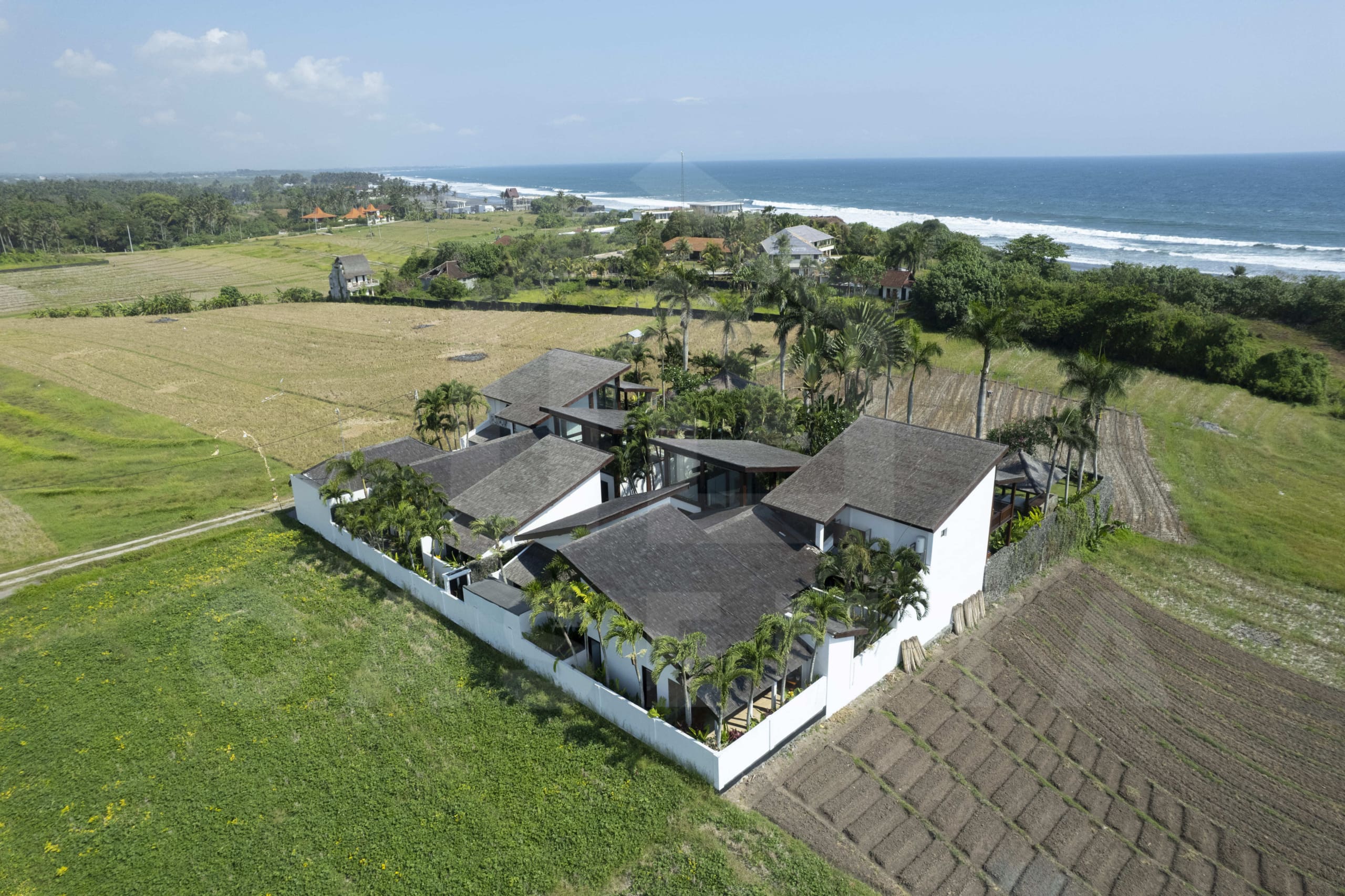 Aerial view of tropical villas in Tabanan coastline