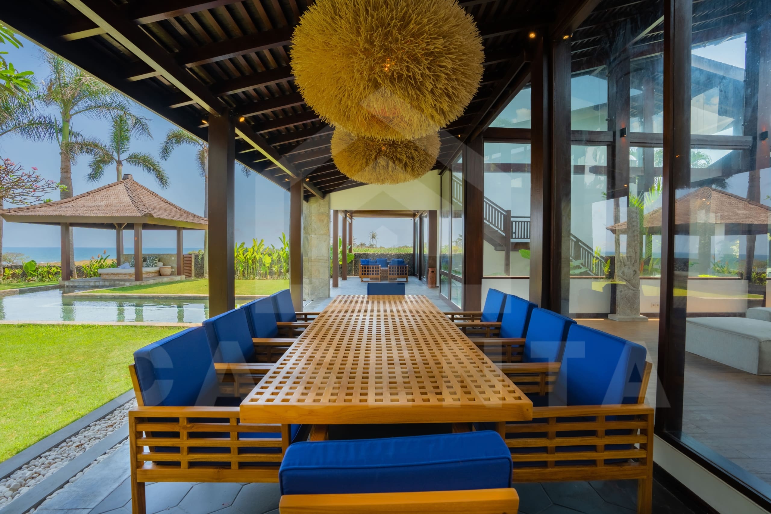 Outdoor dining area inside tropical villas in Tabanan coastline