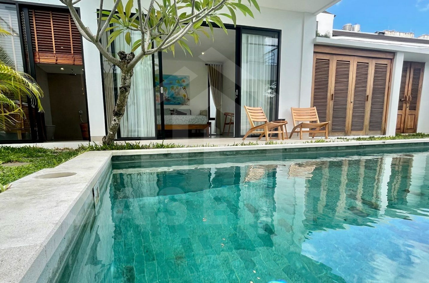 Bedroom by the pool inside stunning villa in Seminyak