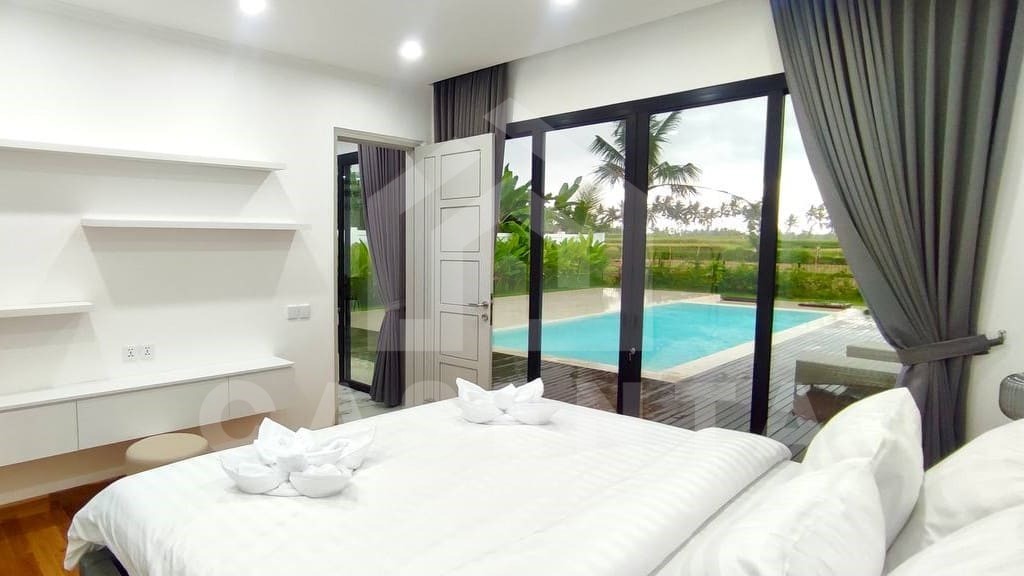 Comfortable bedroom inside beautiful villa in Ubud