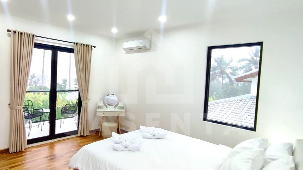 Comfortable bedroom inside beautiful villa in Ubud