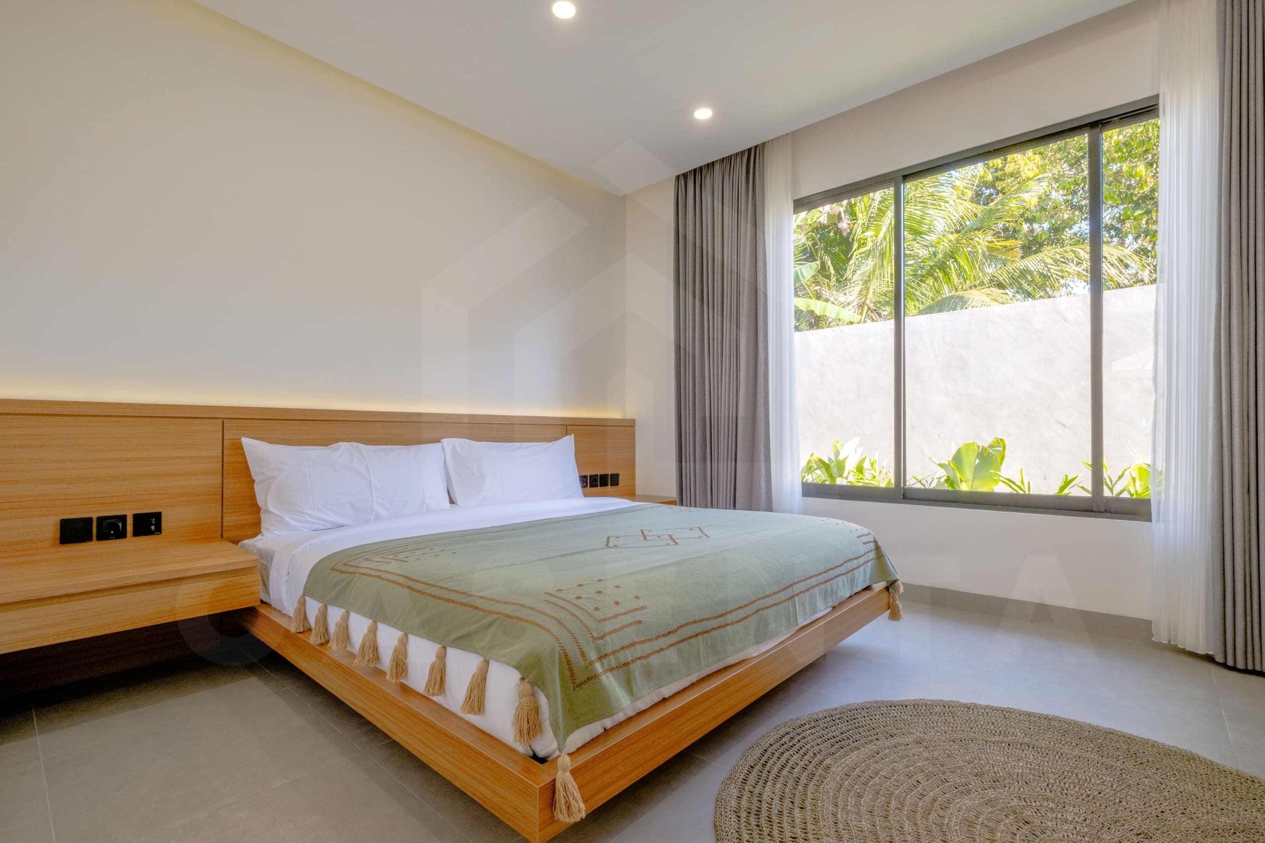 Bright bedroom with king bed and garden view in Ubud leasehold villa