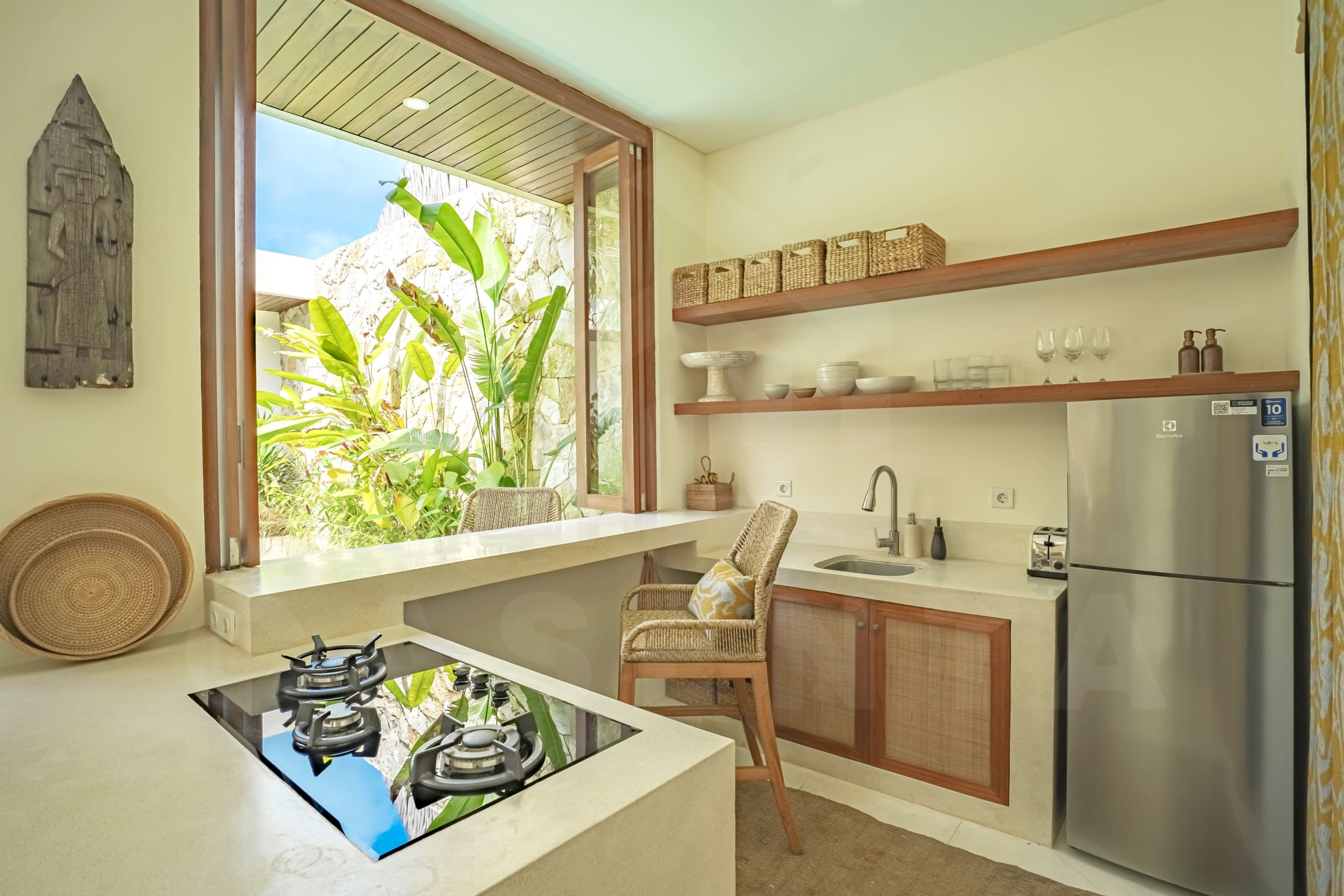 Kitchen/dining area inside attractive 2 bedroom villa in Tumbak Bayuh