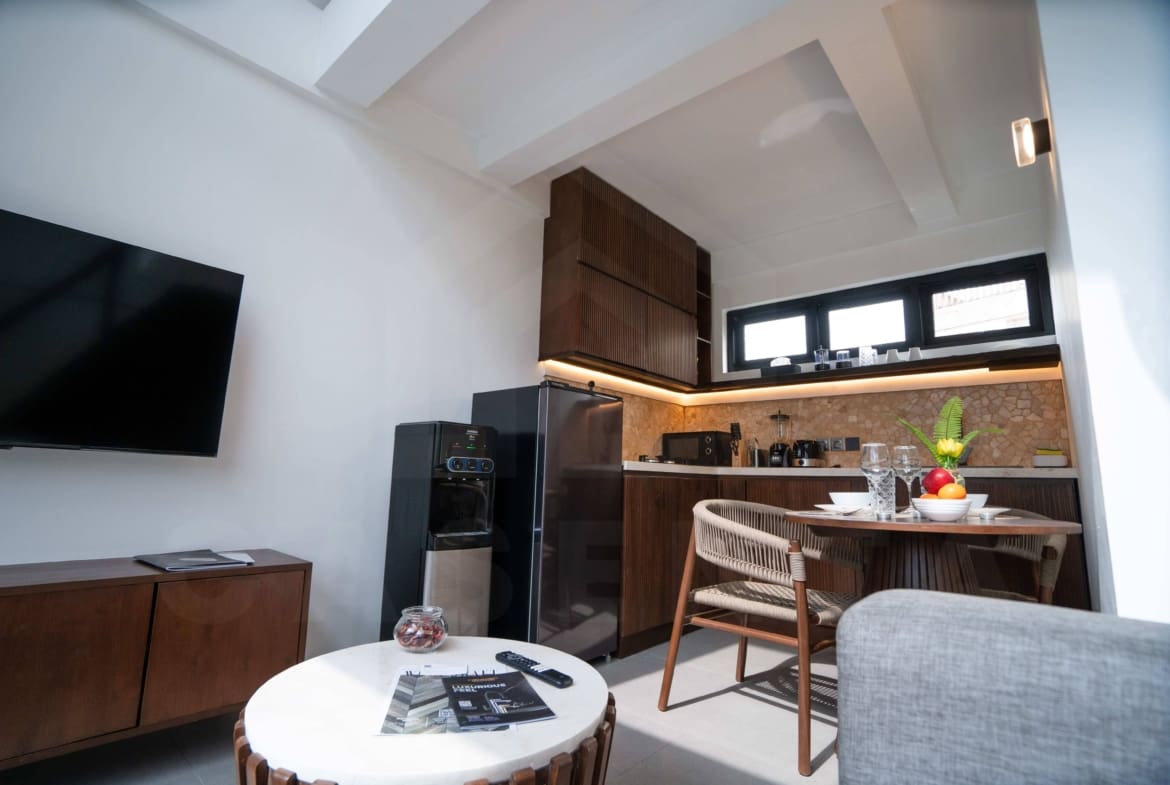 Kitchen/dining space inside stylish apartment in Babakan