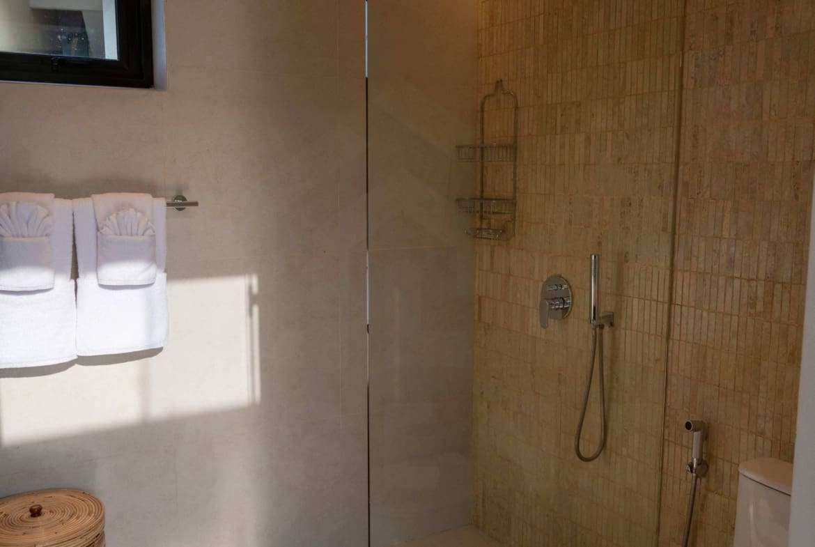 Bathroom inside stylish apartment in Babakan