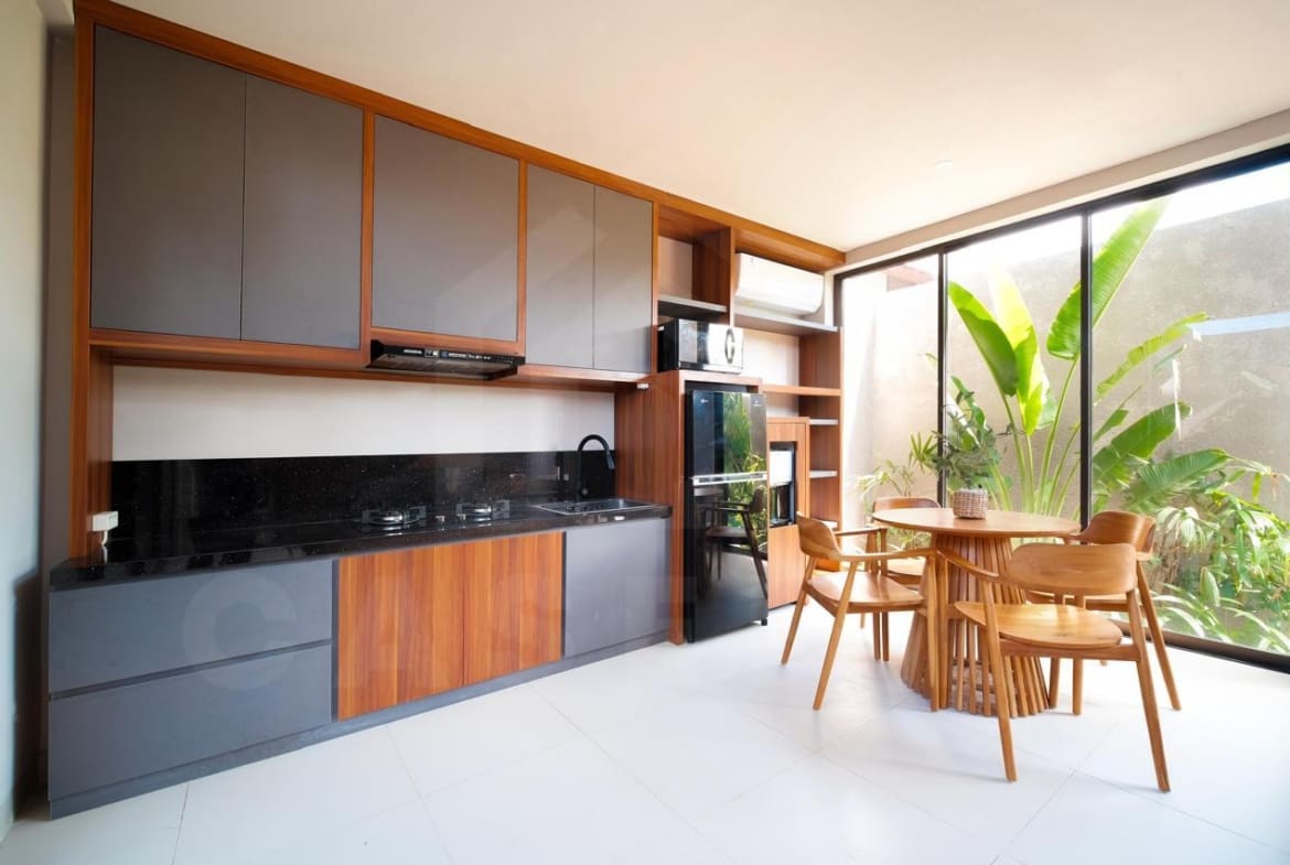 Kitchen and dining space of modern Bali villa