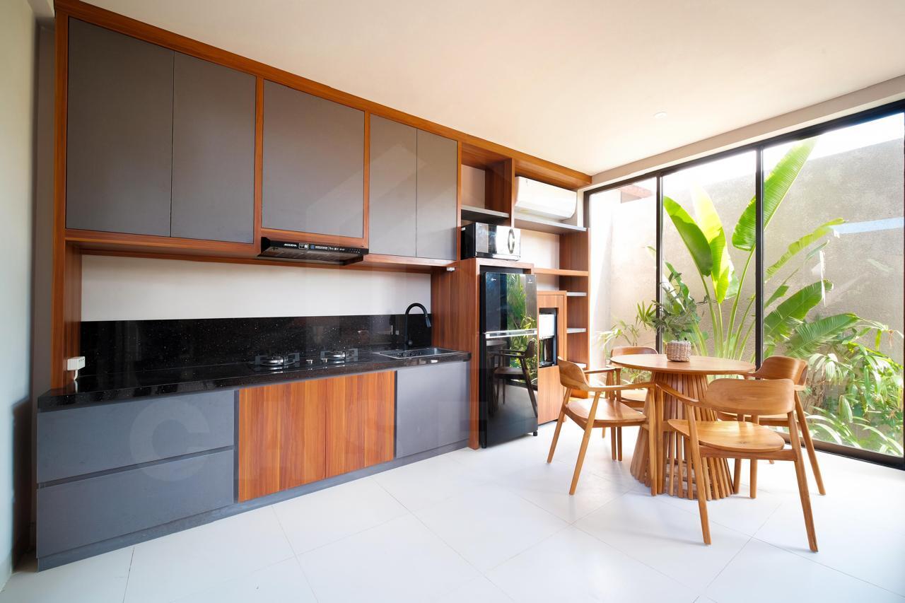 Kitchen and dining space of modern Bali villa