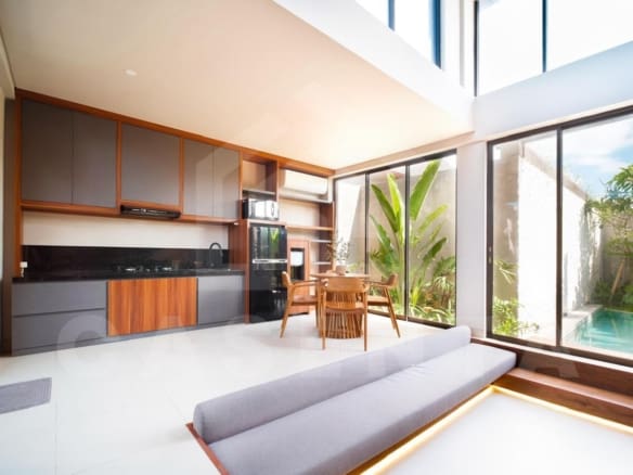 Modern open-plan living and kitchen area in Cemagi villa