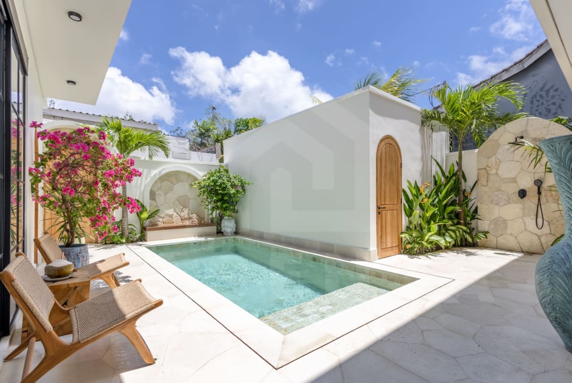 Luxury Balangan villa courtyard with pool, arches, and Mediterranean design