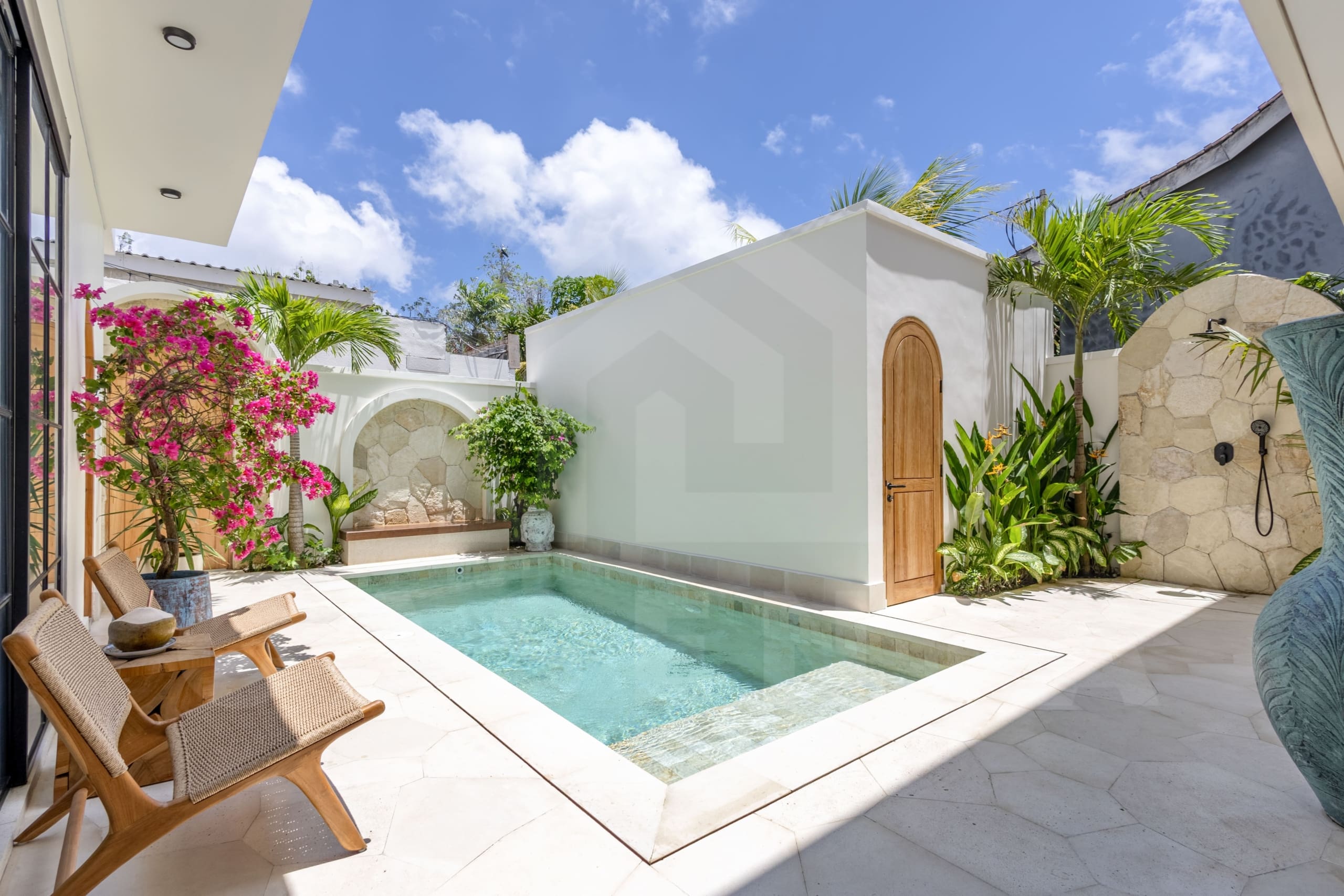 Luxury Balangan villa courtyard with pool, arches, and Mediterranean design