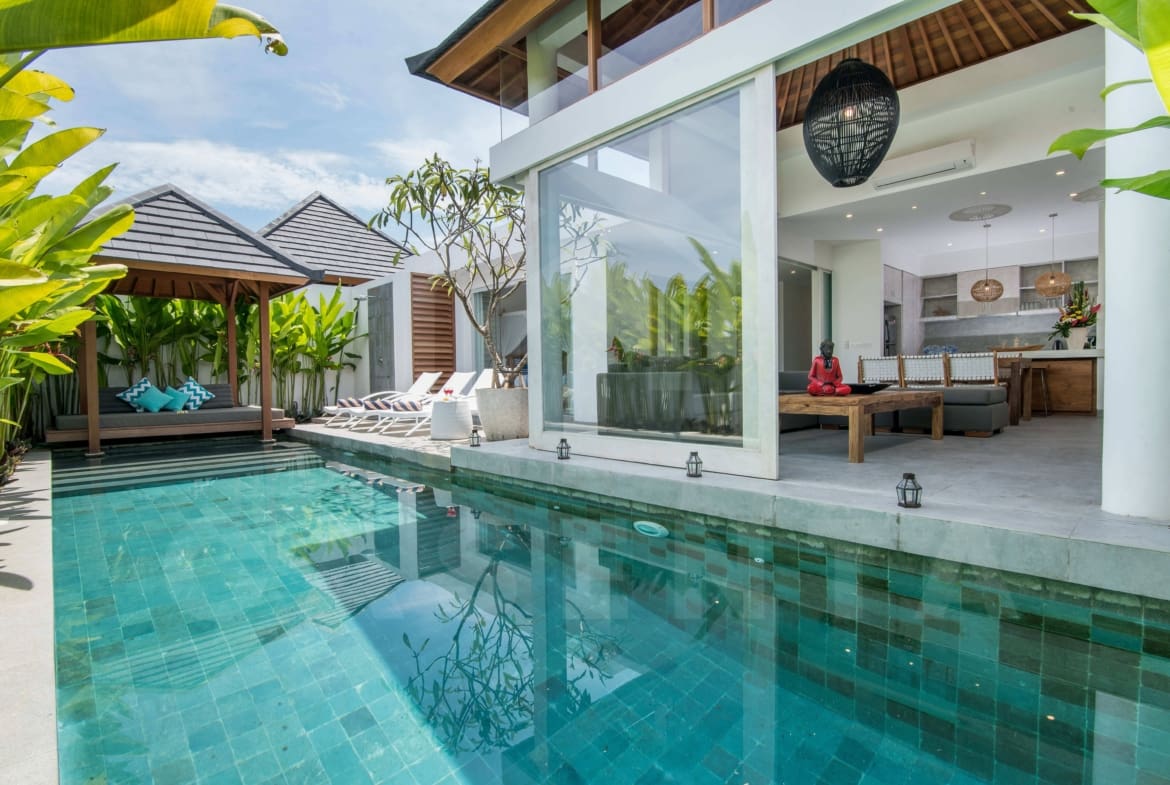 Pool terrace daytime at leasehold villa Berawa Canggu with sun-loungers