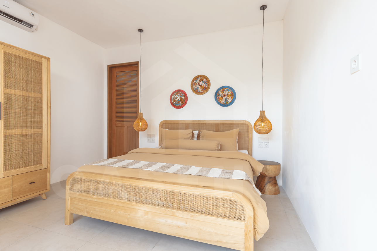 Bedroom with pool view in modern Tabanan villa