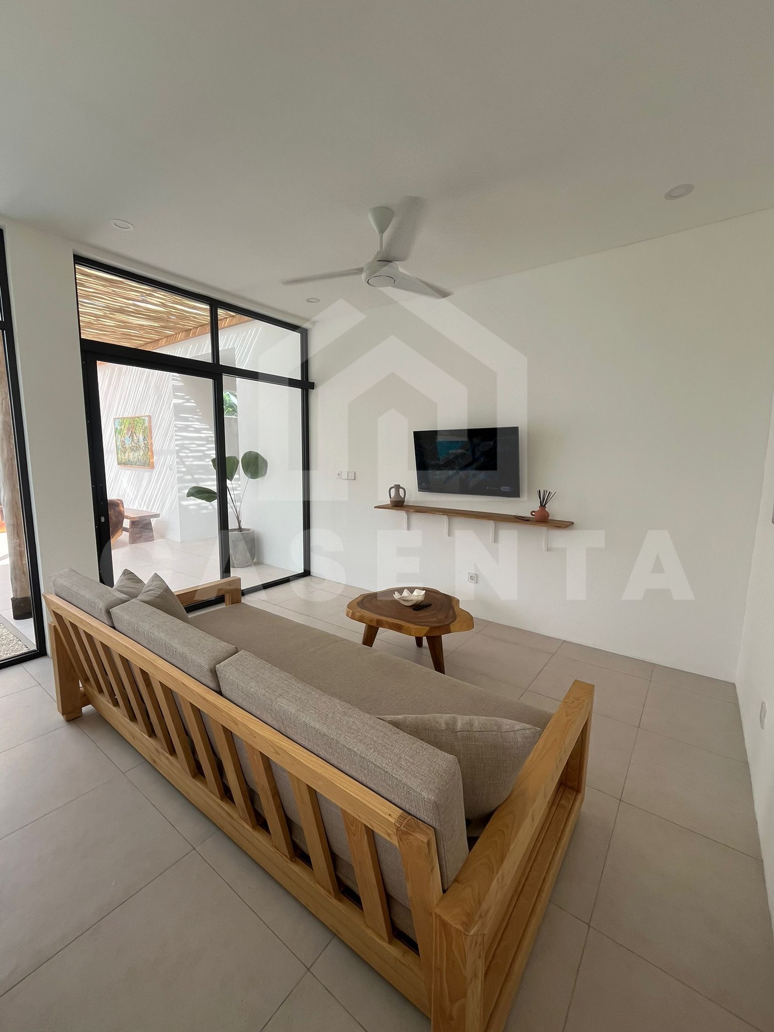 Bright living room in modern villa Tabanan with enclosed tropical design