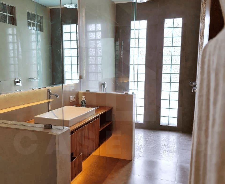 Modern ensuite bathroom of family villa in Kerobokan