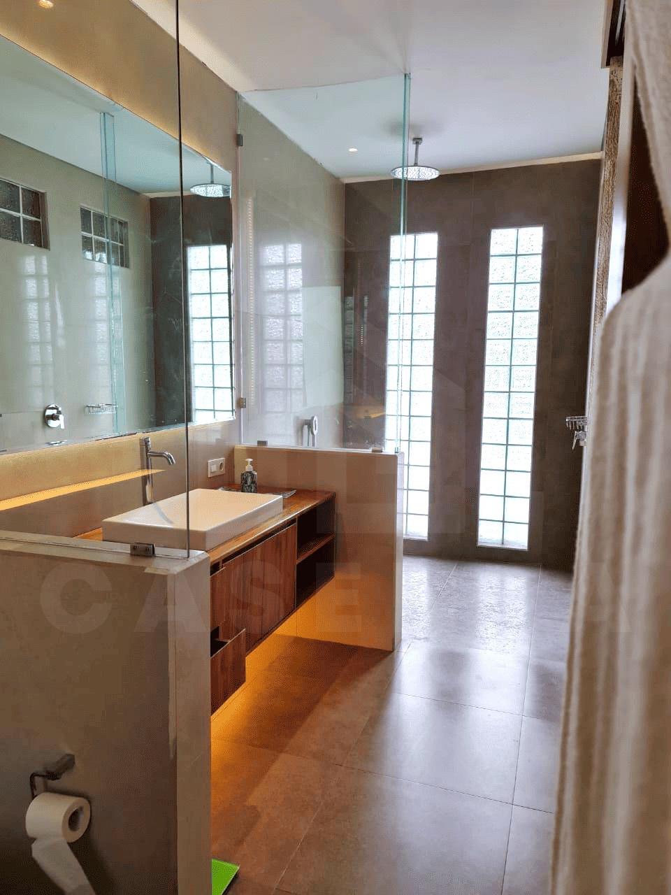 Modern ensuite bathroom of family villa in Kerobokan