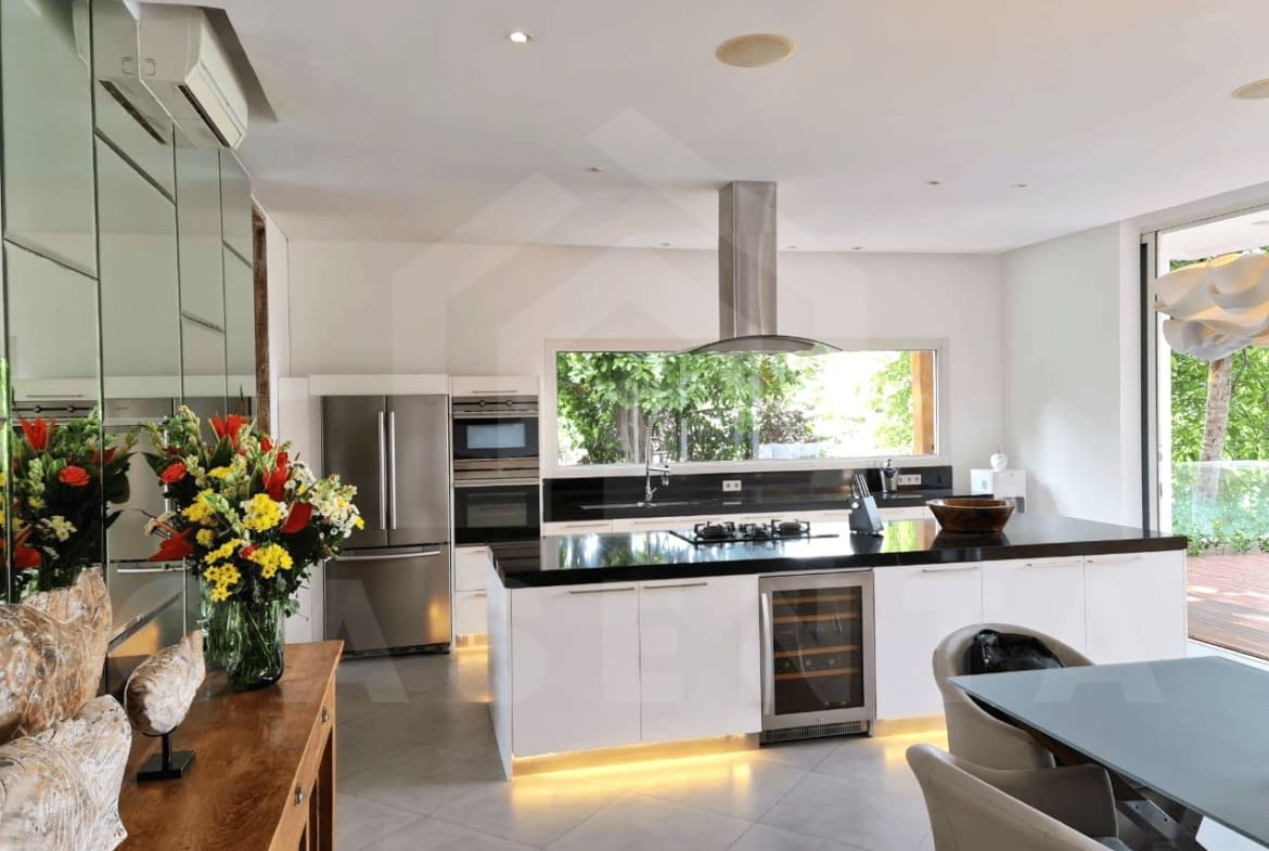 Modern kitchen and dining area in Kerobokan family villa
