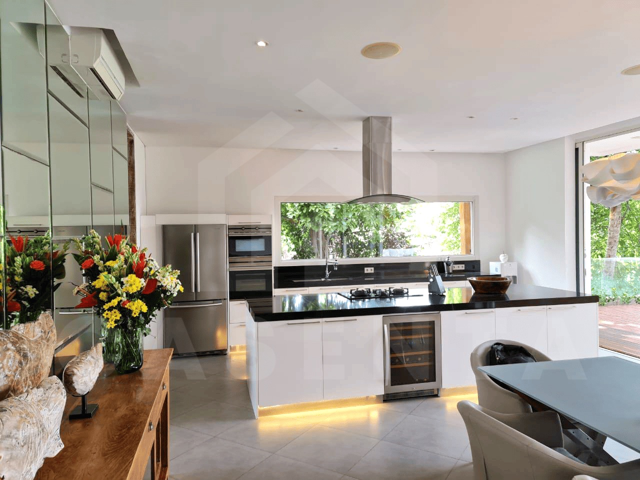 Modern kitchen and dining area in Kerobokan family villa