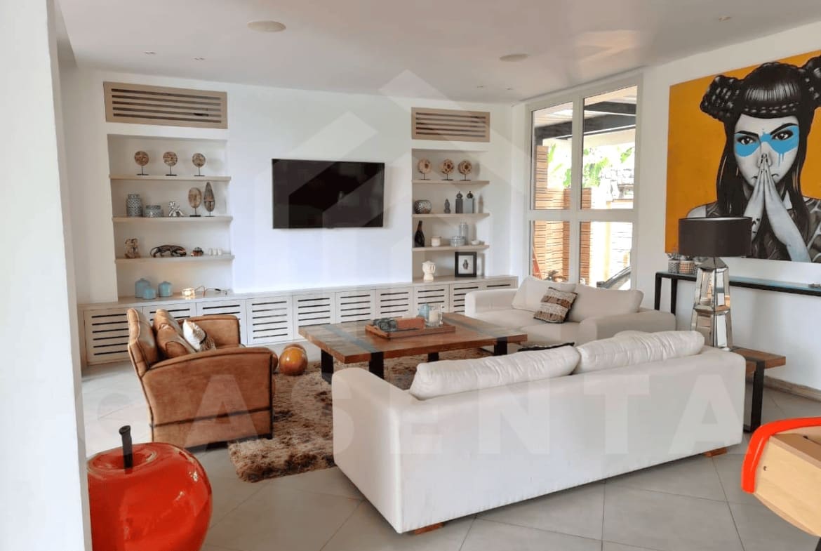 Stylish living and dining interior of family villa in Kerobokan