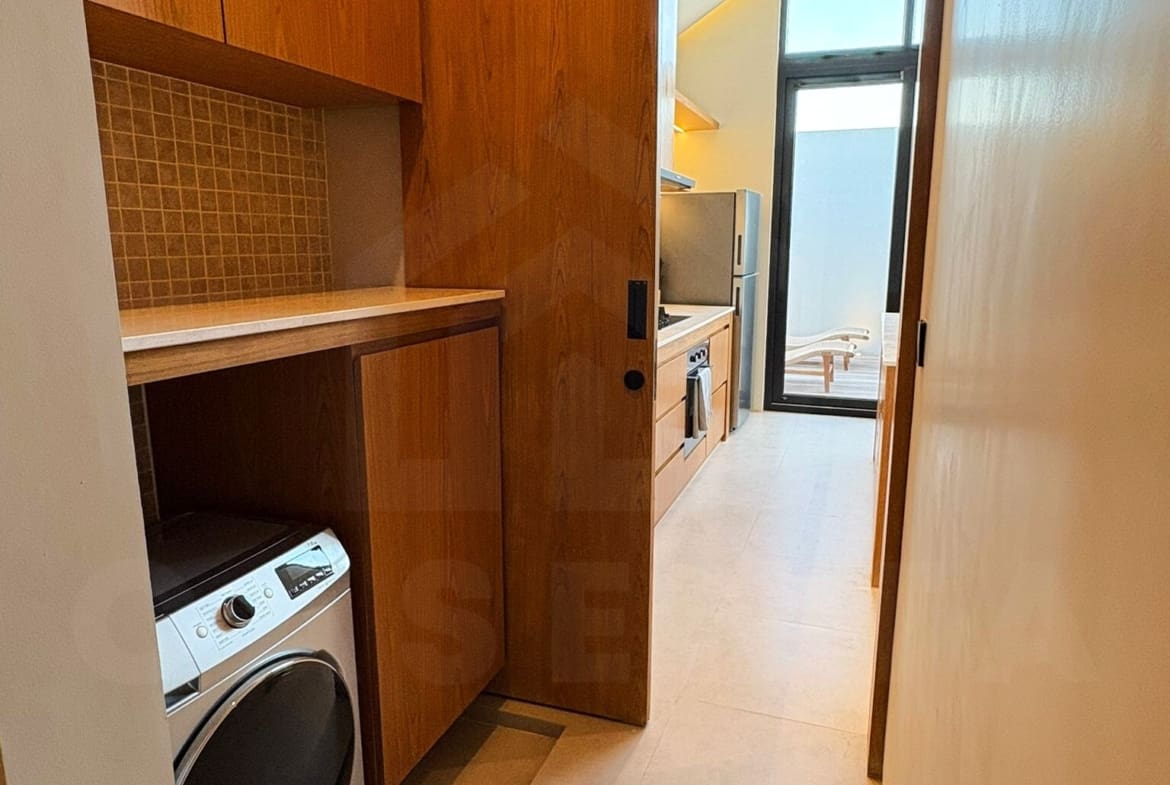 Laundry area and storage space in Tumbak Bayuh villa