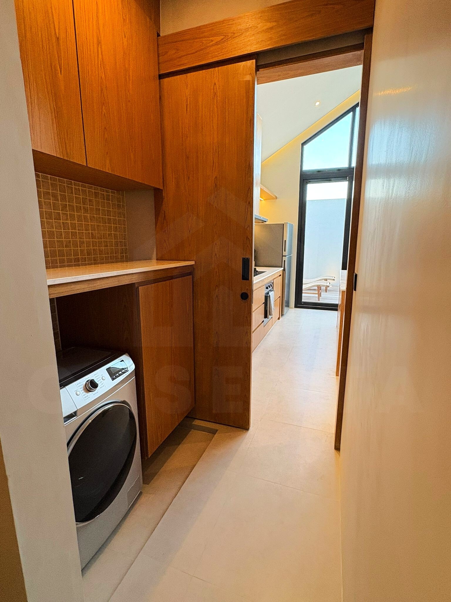 Laundry area and storage space in Tumbak Bayuh villa