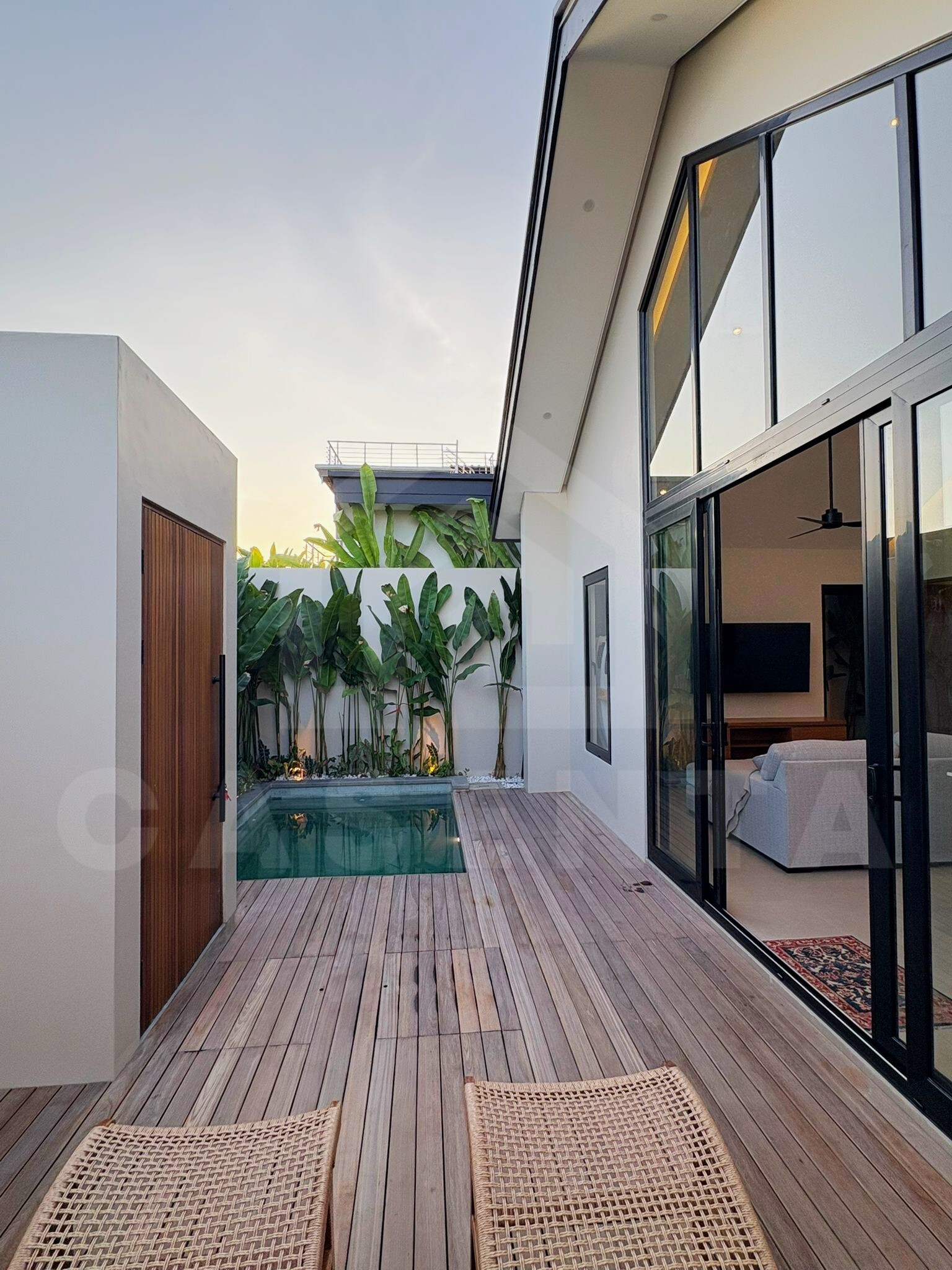 Private pool and wooden deck at Tumbak Bayuh villa, Bali