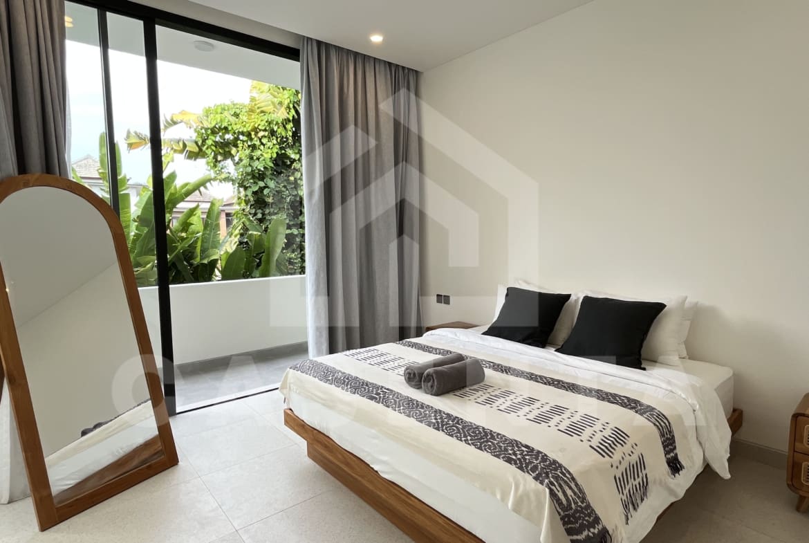 Bedroom with balcony in modern Canggu villa