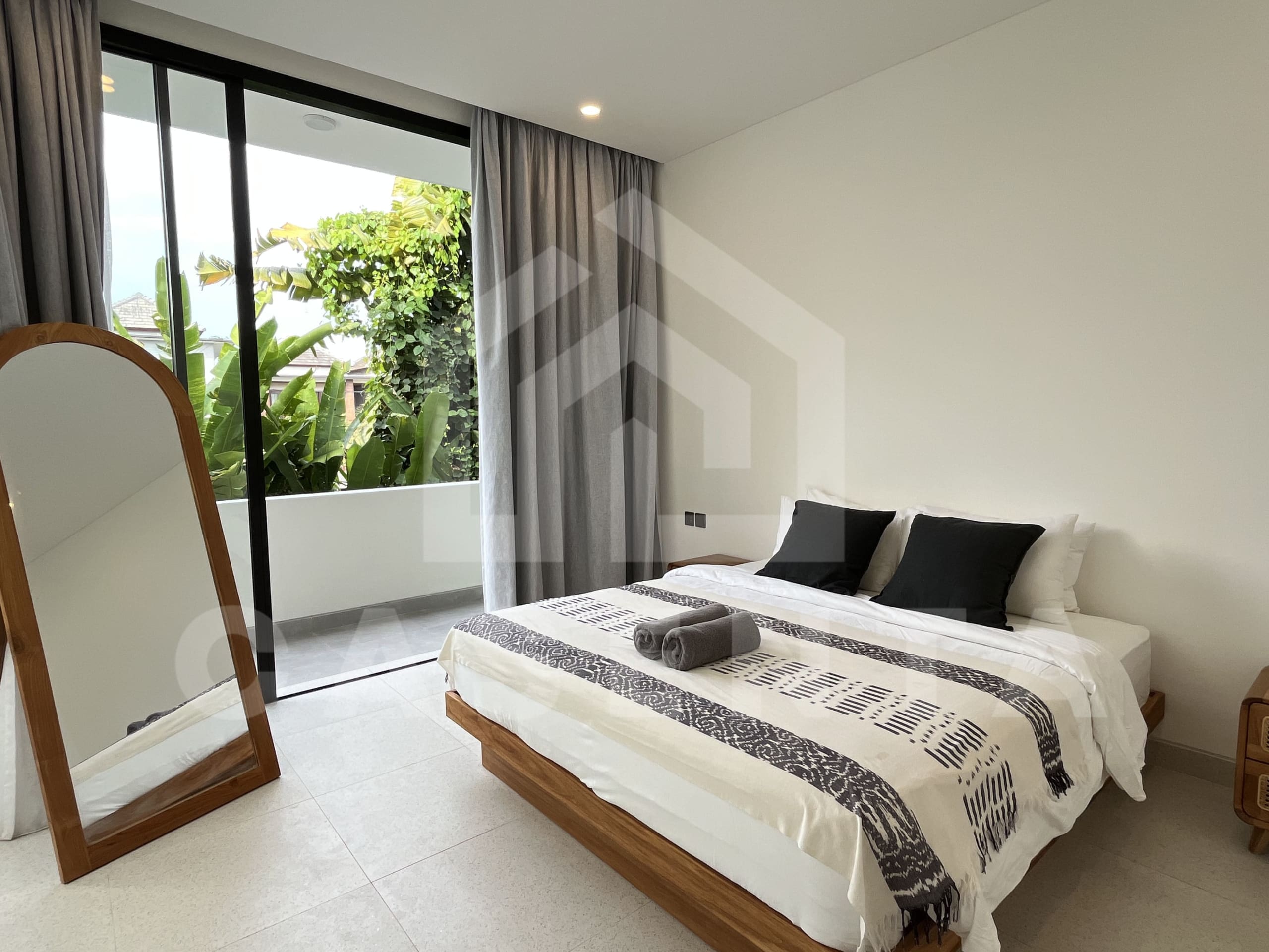 Bedroom with balcony in modern Canggu villa