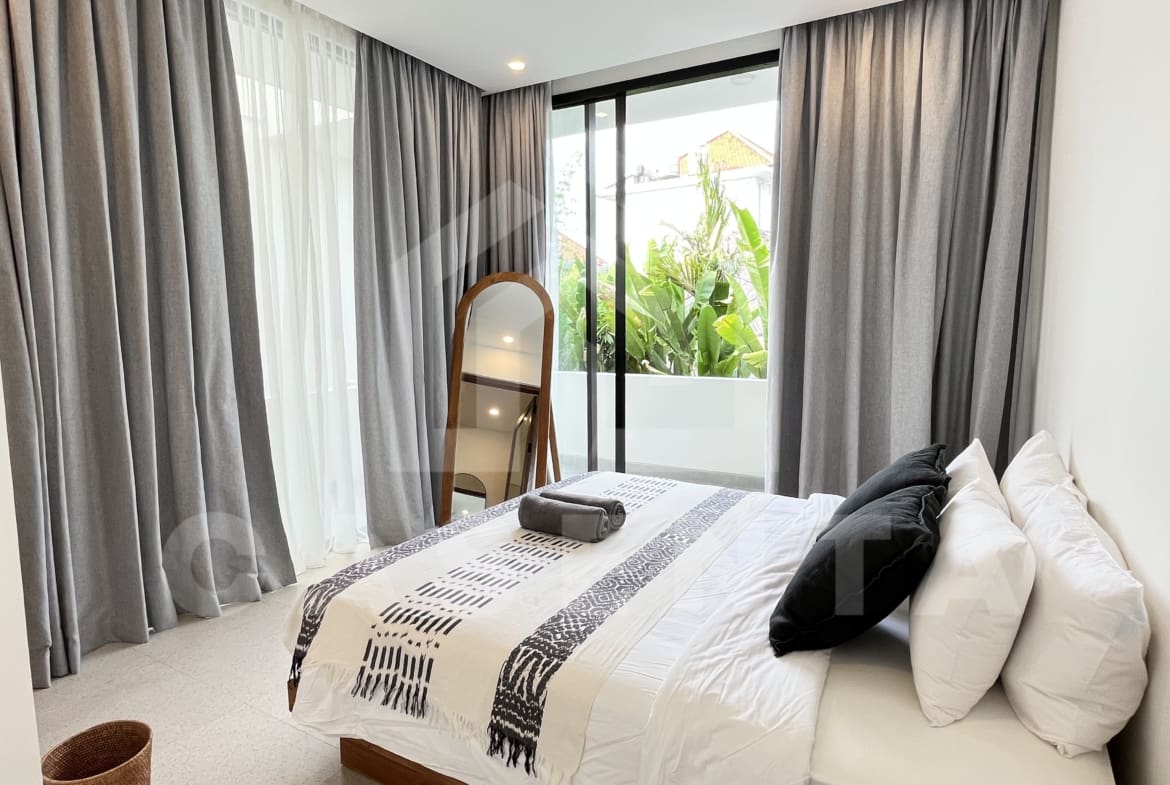 Bedroom with balcony in modern Canggu villa