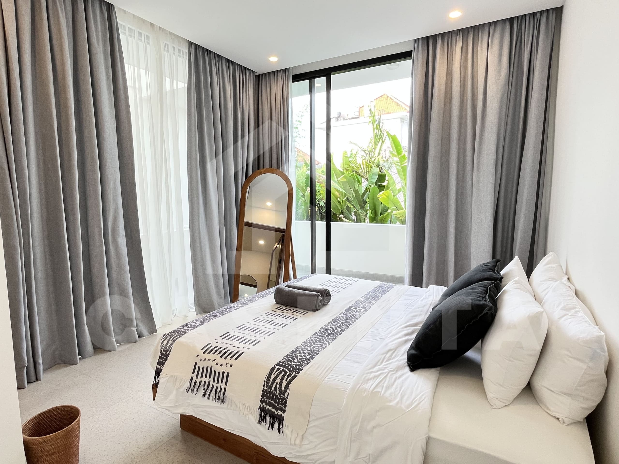 Bedroom with balcony in modern Canggu villa