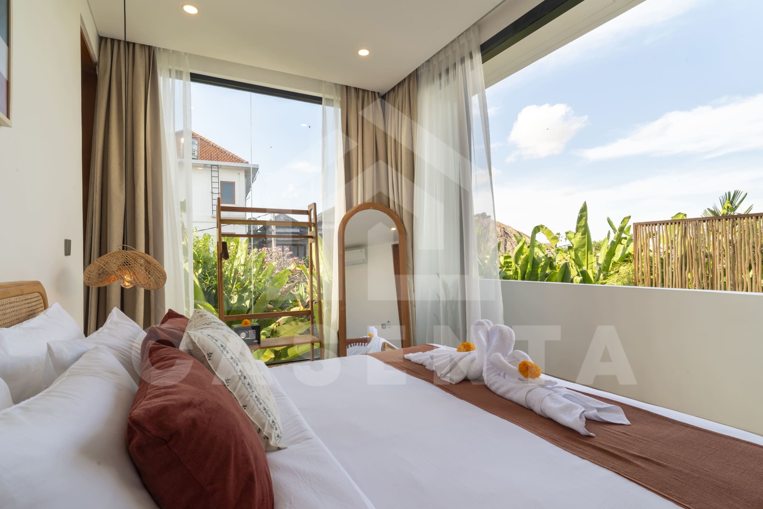 Bedroom balcony overlooking tropical greenery in Canggu villa