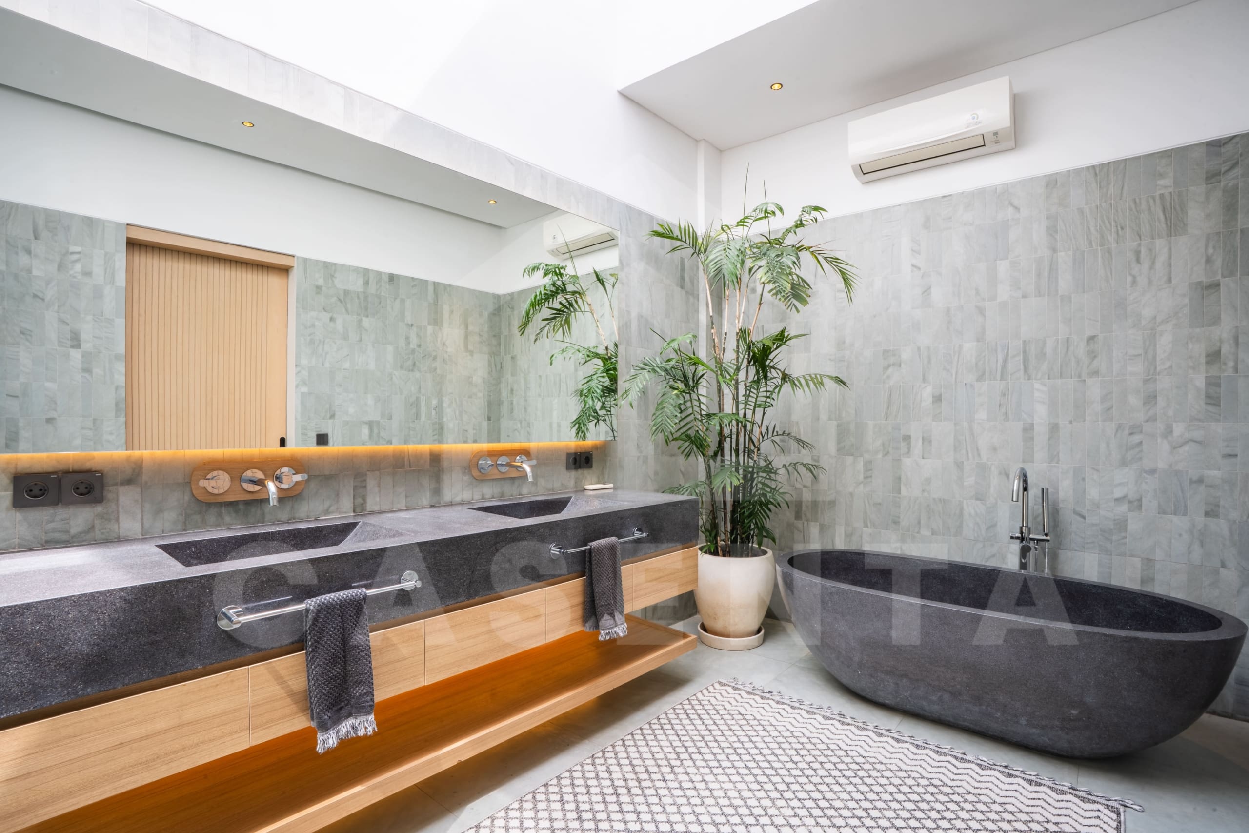 Modern ensuite bathroom in Luxury Villa Tumbak Bayuh with natural light