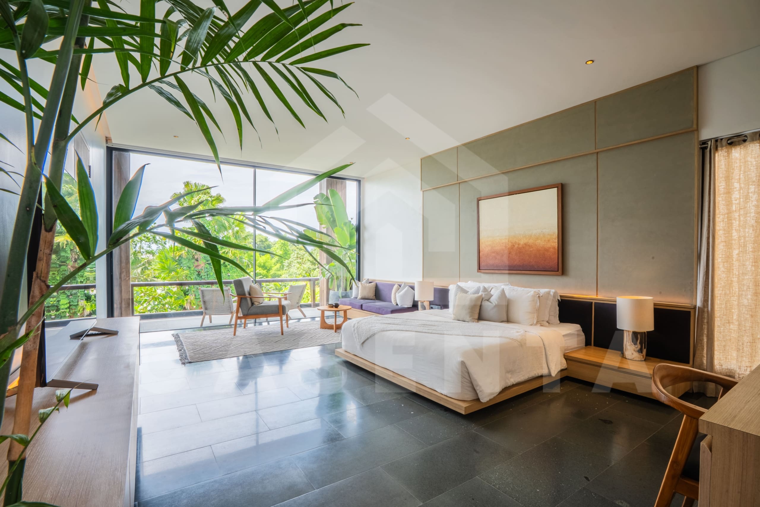Spacious bedroom interior in Luxury Villa Tumbak Bayuh with lounge seating