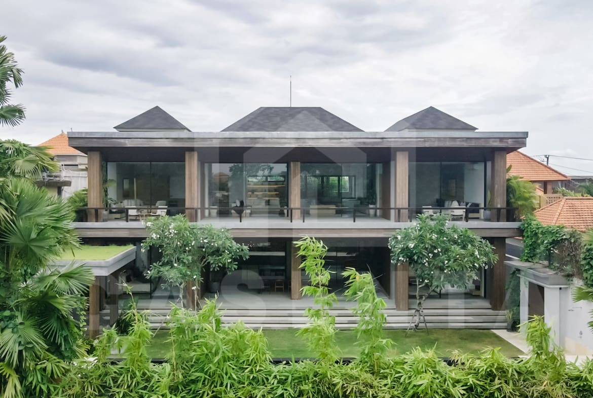 Modern two-storey Canggu villa with tropical landscaping and private balconies