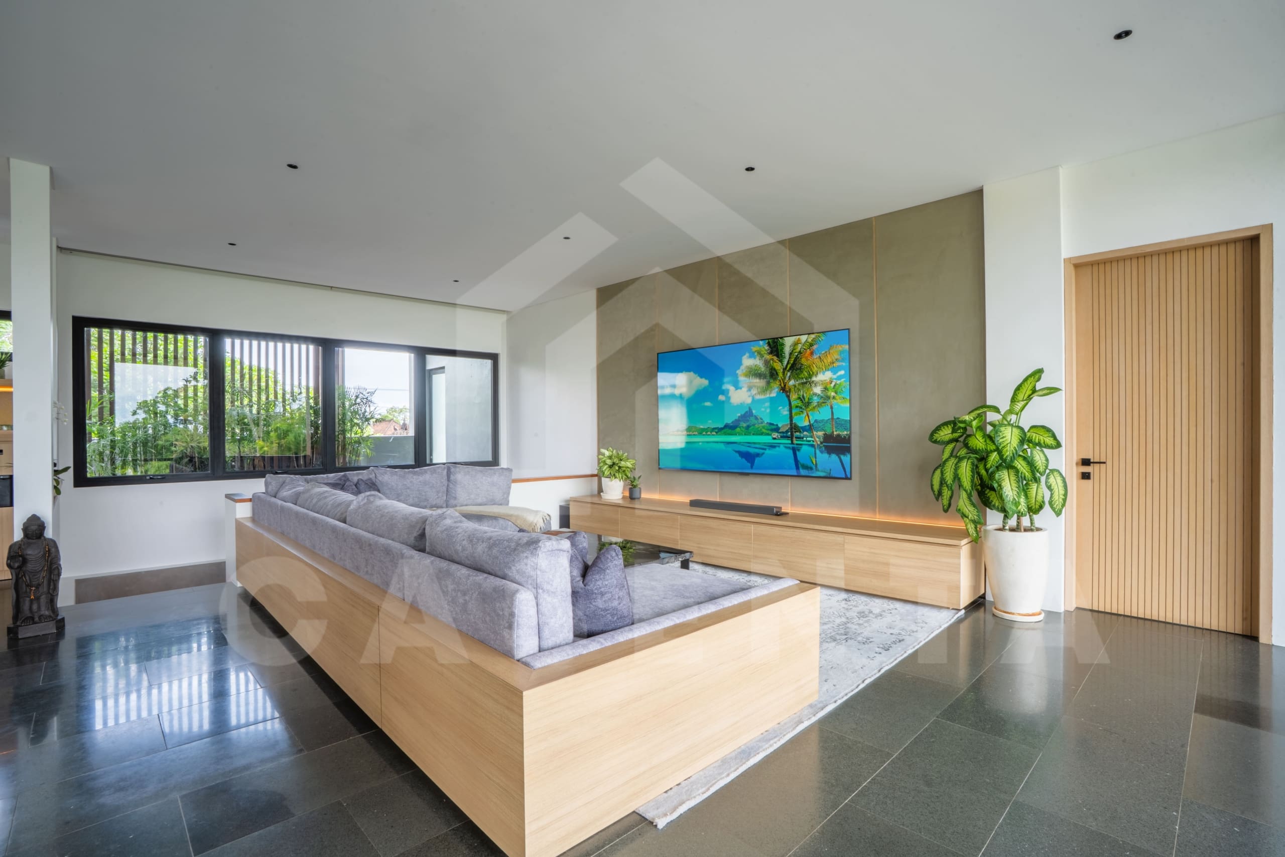 Modern living room with lounge seating in Canggu villa