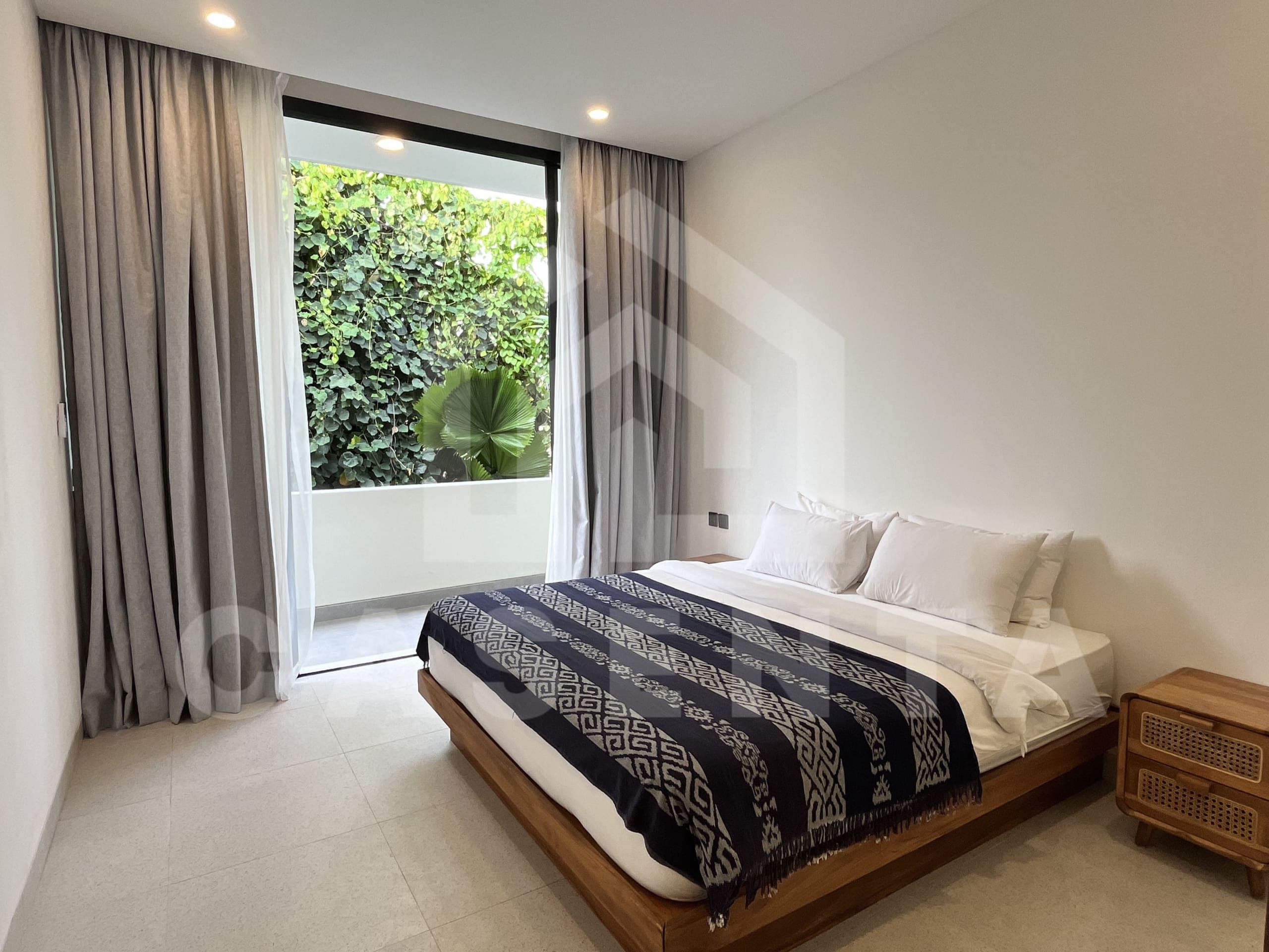 Second bedroom with natural light in modern Canggu villa