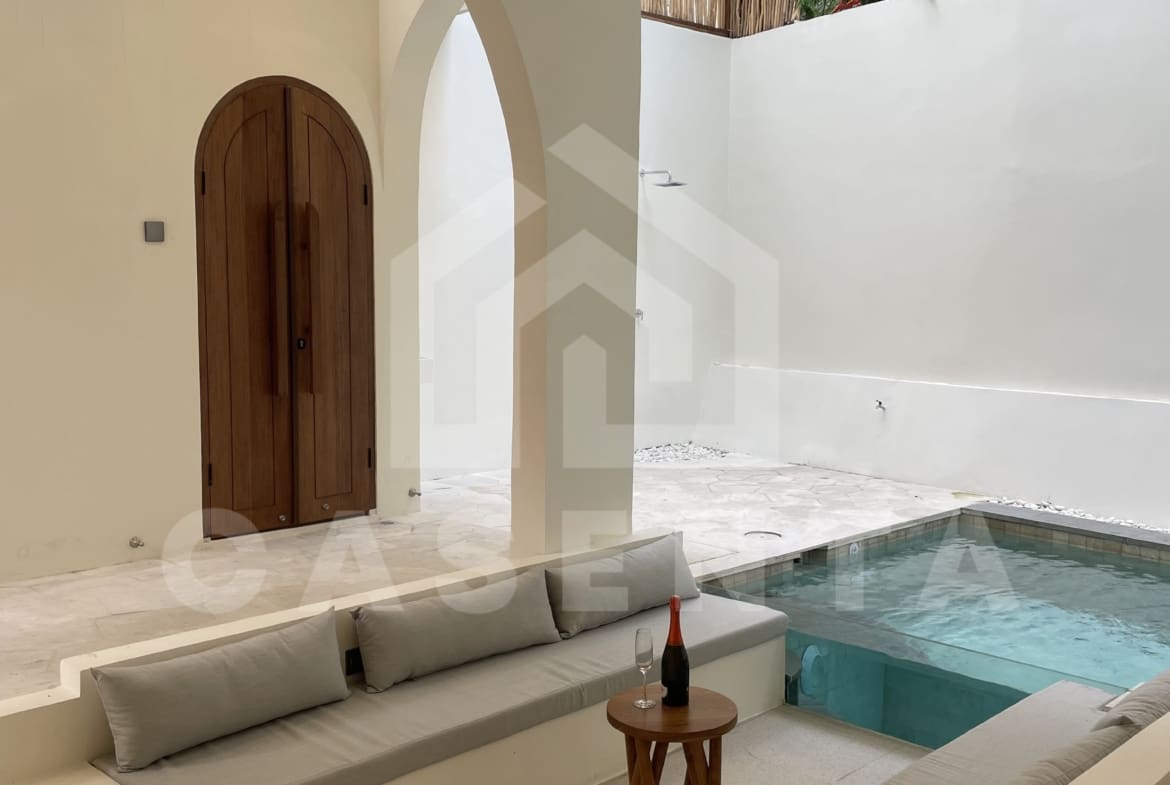 Sunken poolside seating in modern Canggu villa