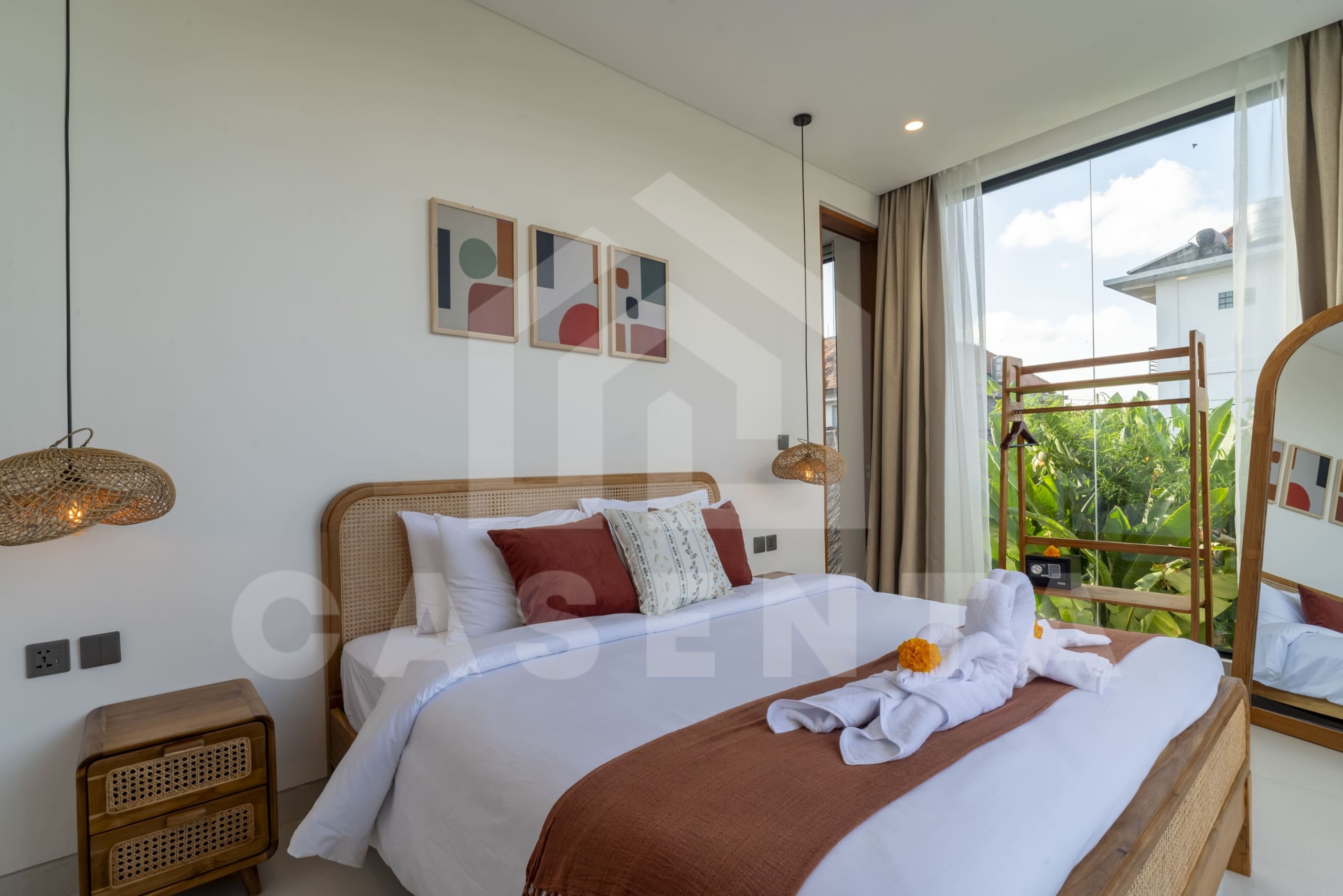 Upper-level bedroom with balcony access in Canggu villa