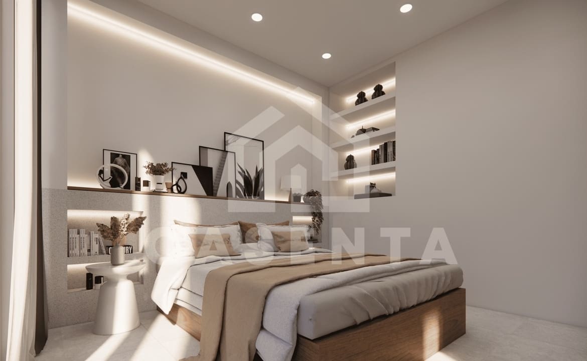 Spacious ensuite bedroom with modern shelving and decor