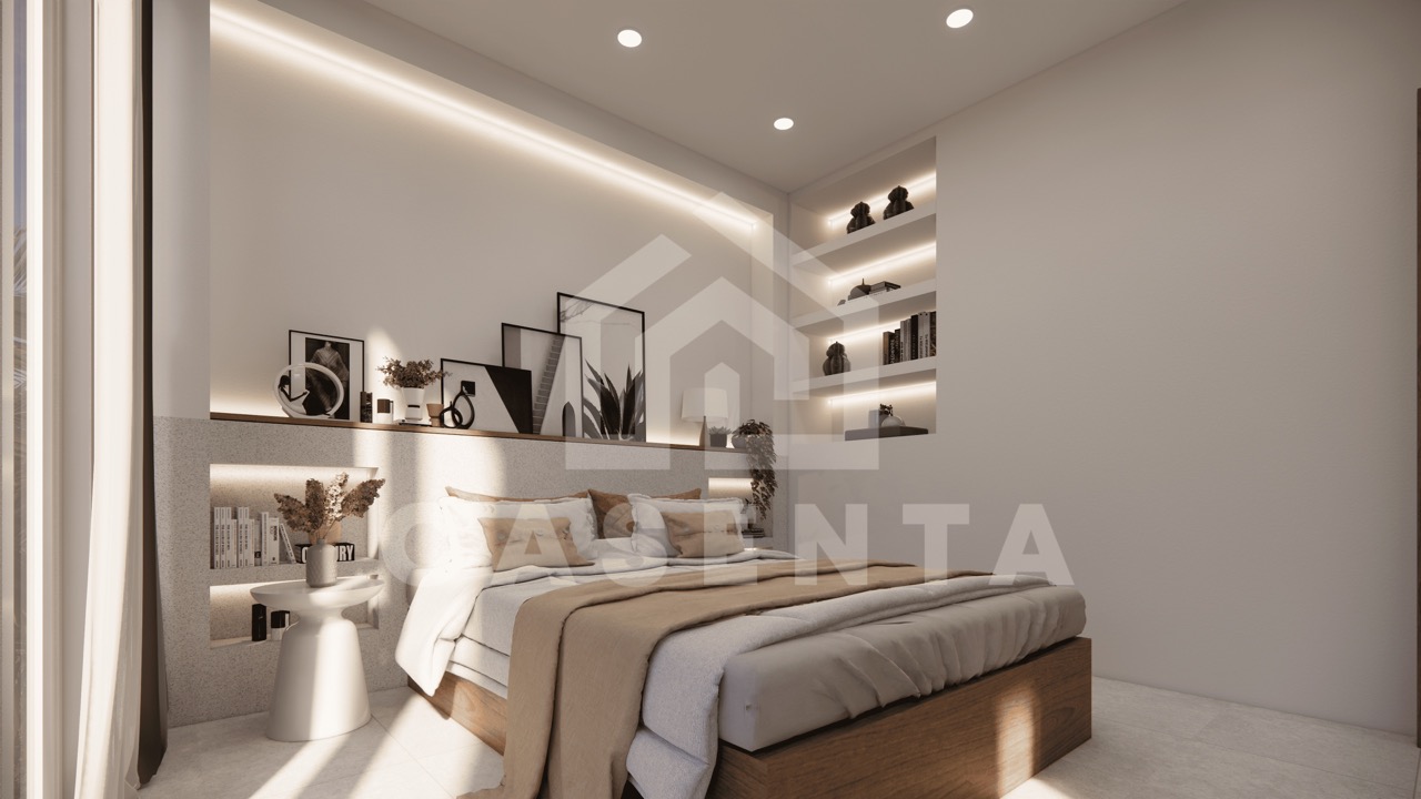 Spacious ensuite bedroom with modern shelving and decor