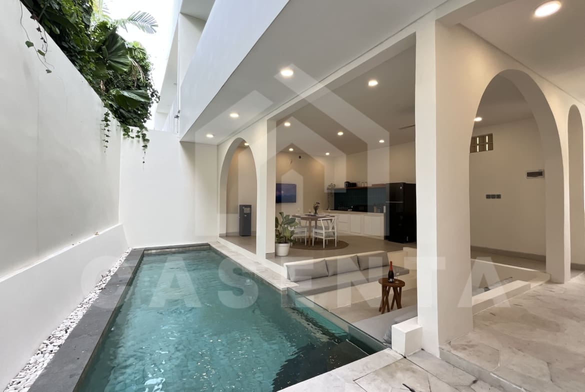 Private swimming pool beside living area in Padonan villa