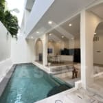 Private swimming pool beside living area in Padonan villa