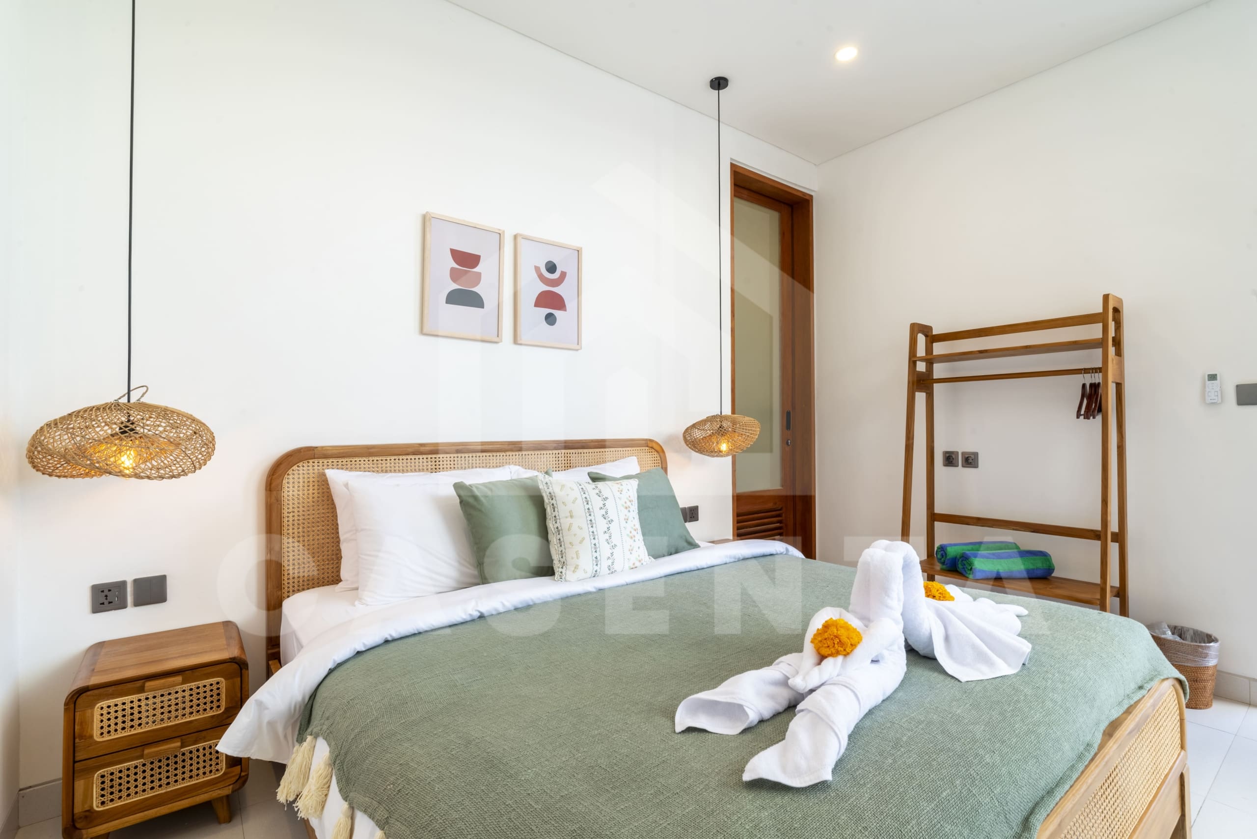 Ensuite bedroom with natural wood finishes in Canggu villa