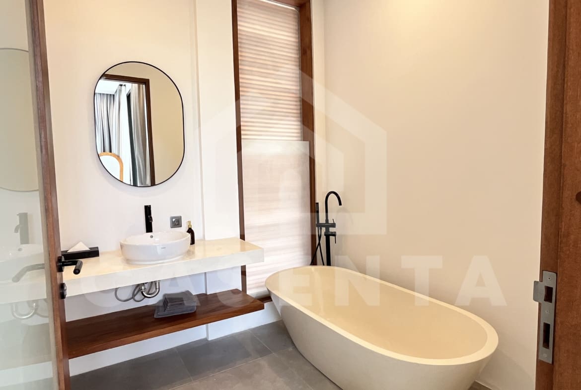 Ensuite bathroom with freestanding bathtub in Canggu villa