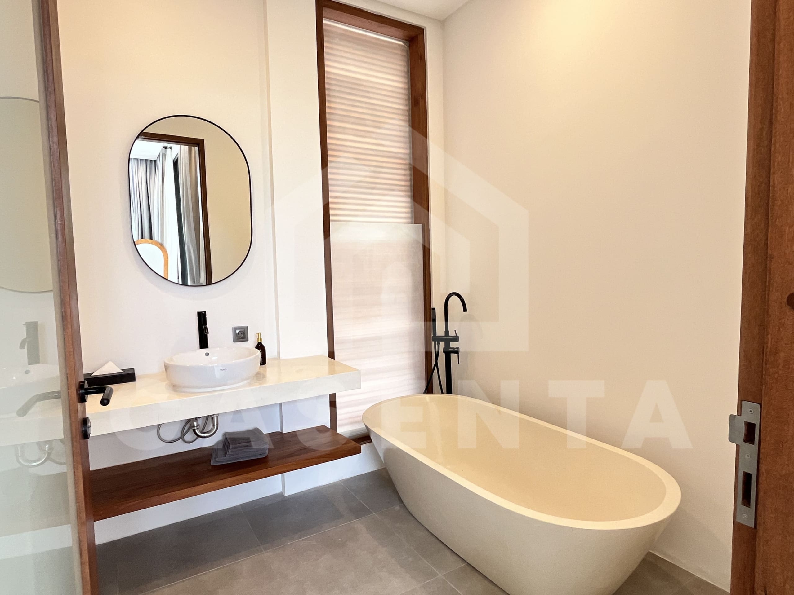 Ensuite bathroom with freestanding bathtub in Canggu villa