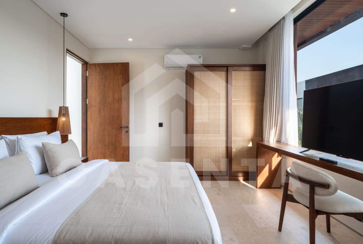Contemporary 1BR Batu Bolong Villa bedroom with natural light and built-in wardrobe