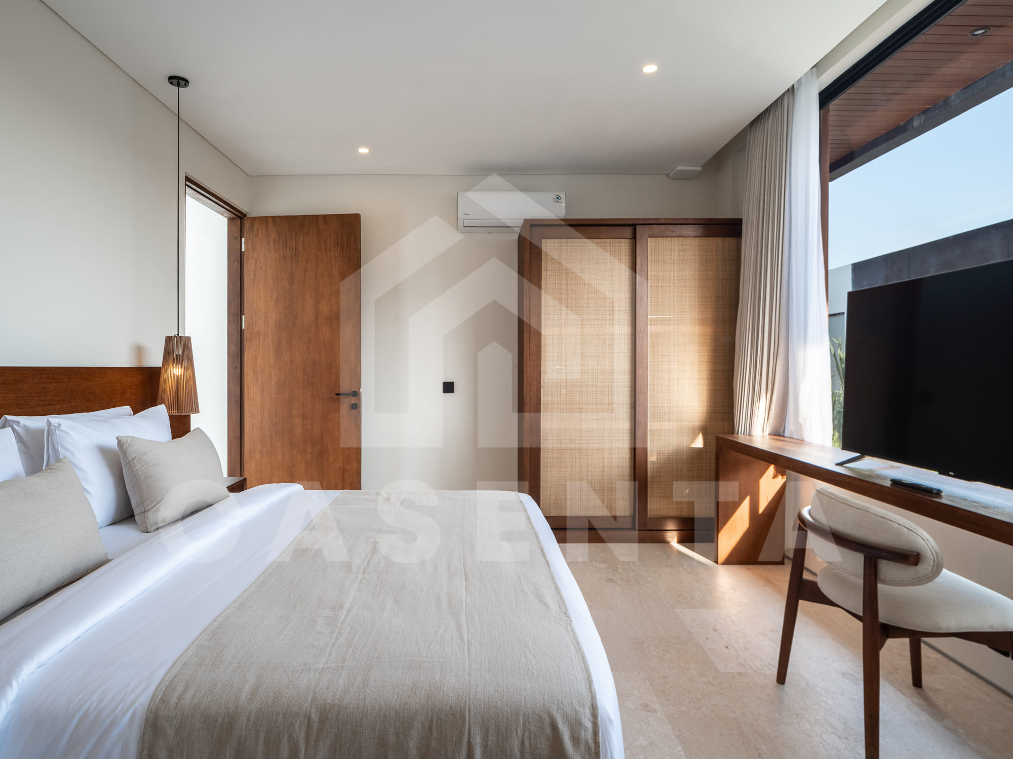Contemporary 1BR Batu Bolong Villa bedroom with natural light and built-in wardrobe